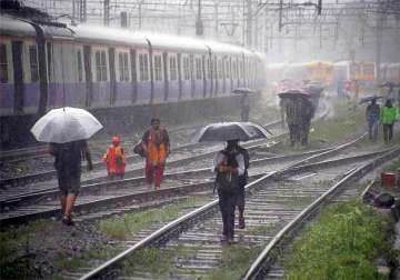 rains halt mumbai 2 killed rail commuters hit hard