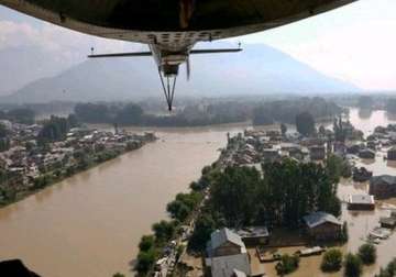 ministers brave flood water to reach secretariat