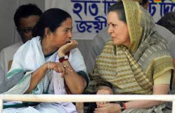 mamata meets sonia explains tc s absention from voting in rs