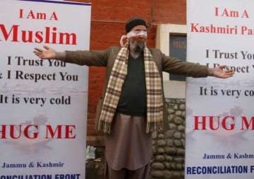 blindfolded kashmiri pandit invites hugs to spread message of tolerance