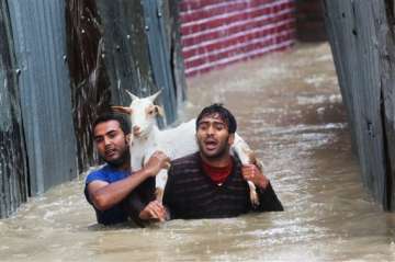 j k battling worst floods in six decades toll climbs to 48