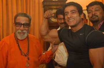 maratha bodybuilder flexes his muscles before bal thackeray