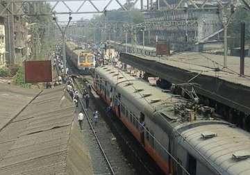 suburban train services hit in mumbai as angry commuters protest delays