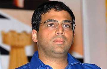 sibal apologises to anand after row over nationality queries