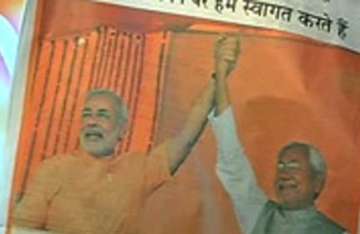 patna police raids ad agency office over nitish modi ad