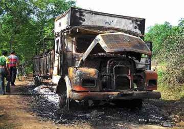 suspected maoists set 20 vehicles on fire