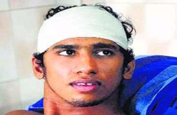 brutally beaten a month ago balakrishnan swam to the semis and a record