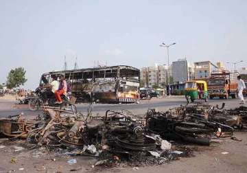 uneasy calm in violence hit gujarat toll rises to 10