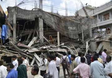 residents feared trapped in building after staircase collapse