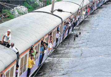 rains halt mumbai commuters hit hard as local trains cancelled