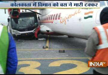 bus hits parked aircraft at kolkata airport