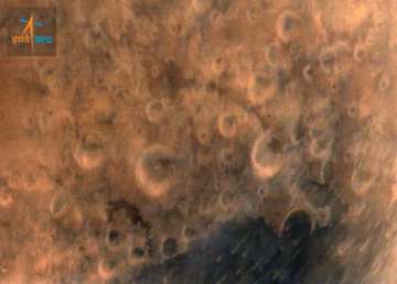 isro releases first picture of mars taken by mangalyaan