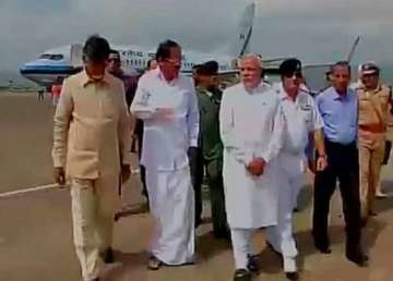 pm narendra modi arrives at vizag airport to make aerial survey of hudhud hit regions