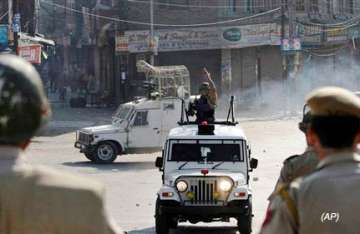curfew in more areas of kashmir valley flag march by army