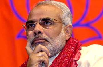 modi seeks apology from pm on pc s saffron terror remarks