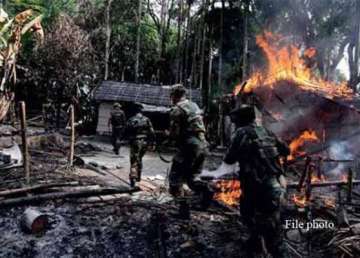 adivasis in assam retaliate kill two bodos torch a village