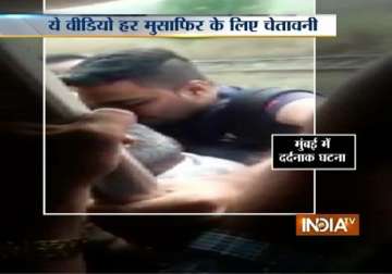 caught on camera 21 year old falls off overcrowded mumbai local dies