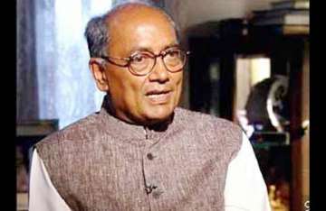 no need for kalmadi to resign says digvijay singh