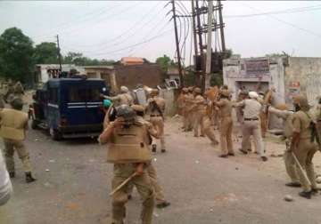 army stages flag march in samba 14 injured in clashes