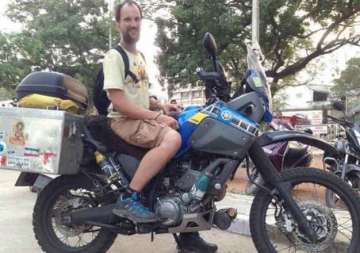 man comes to india all the way from germany on bike
