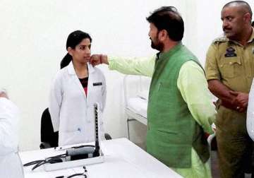 picture of j k bjp minister touching woman doctor s collar goes viral