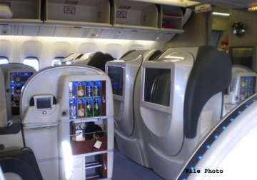 to cut costs government bars first class air travel for officials