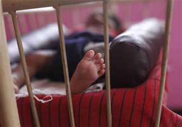 infant girl found dead in her cradle with rope round her neck