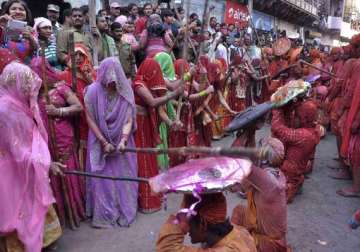 know about lathmar holi of barsana when women beat men with sticks