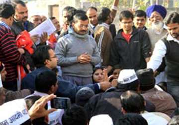 live reporting kejriwal s first janata durbar ends in chaos as thousands converge