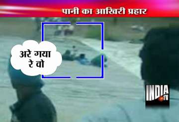 live footage of man being swept away in sudden river flood in mp