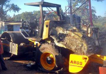 maoists set on fire excavator machine