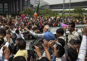 modi holds roadshow in delhi amidst cheering crowds