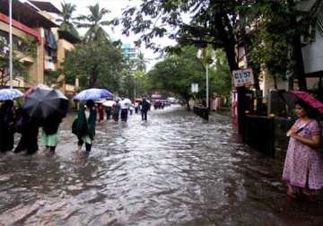 heavy rains paralyse life in mumbai road rail traffic hit