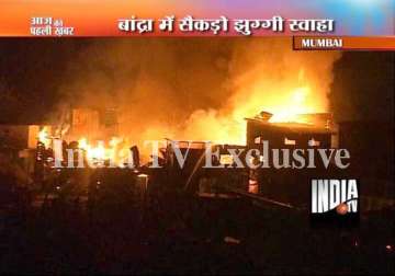 more than 100 slum dwellings gutted in fire near bandra mumbai