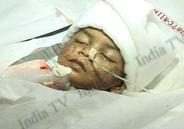 mystery continues over delhi battered baby s parents five persons passed her to one another