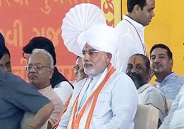 narendra modi brings priests of all faiths to fast venue