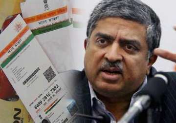 nilekani succeeds in persuading narendra modi to continue with aadhar project