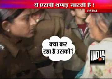 policing patna style female sp city slaps woman woman slaps in return police beat up her son