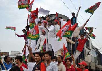 protesters block railway tracks burn pm effigy to protest rail fare hike