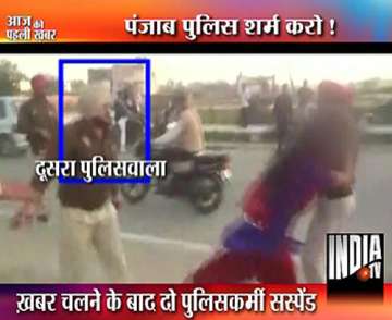 punjab cops thrash woman two suspended