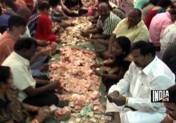 shirdi sai baba gold silver cash pour in as donations from devotees during guru poornima