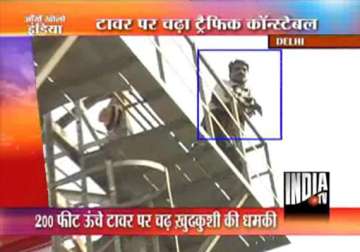sholay style delhi traffic policeman threatens to jump from 200 ft high tower in ajmeri gate