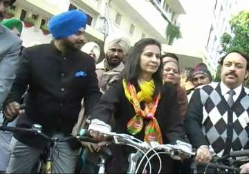 sidhu s wife navjot rides bicycle to file nomination