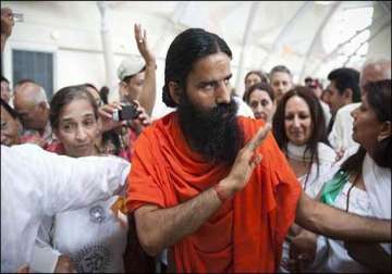 swami ramdev asks congress workers to remain humble
