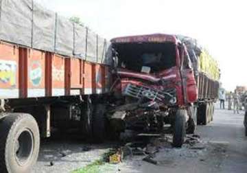 three killed as trucks collide