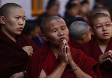 tibetan exiles offer prayers for flood hit