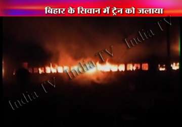 train set on fire after 9 students were killed in train bus crash in bihar