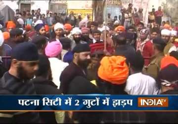 two sikh groups attack each other with swords in gurudwara on gurupurab
