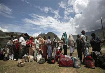 uttarakhand 2 500 people still stranded in badrinath rains hamper rescue work nearly 600 unclaimed bodies cremated