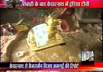 uttarakhand tragedy shoes handbags purses mud inside kedarnath sanctum sanctorum cashboxes looted by vandals watch video